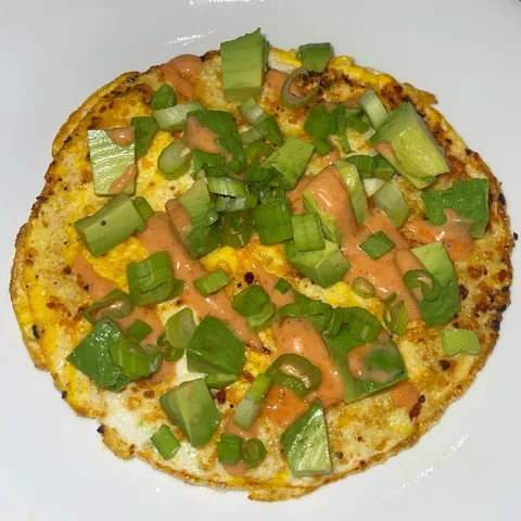 chilli crunch eggs (topped with scallion, avocado, spicy mayo)